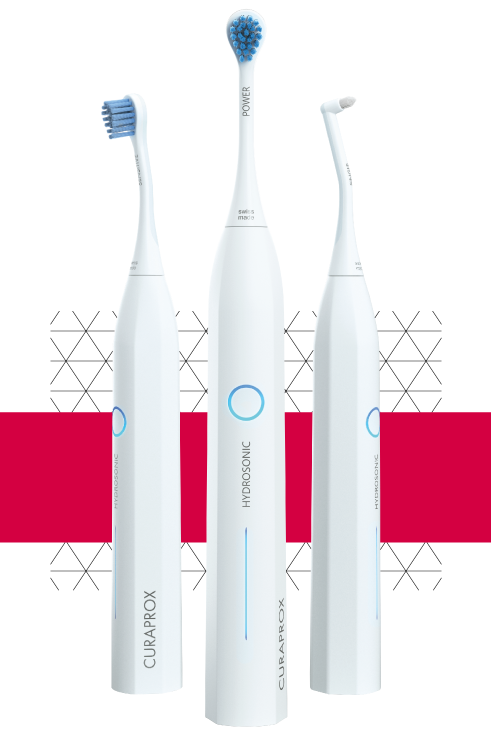 Three Curaprox Sonic electric toothbrushes with red box and a polygon pattern in the background.